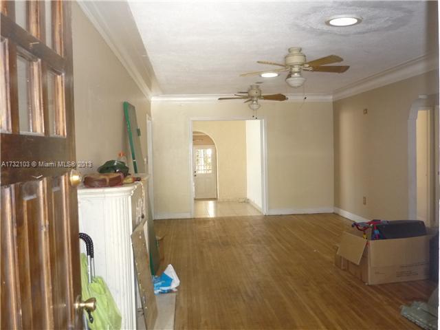 435 Southwest 18th Road Miami, FL 33129 - Photo 5 of 25 a view of a kitchen with fridge and wooden floor