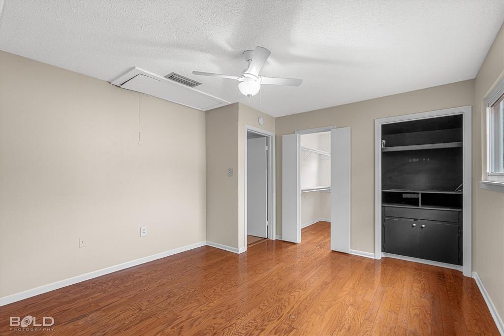 15 Lee Lane Haughton, LA 71037 - Photo 17 of 39 a view of empty room with wooden floor and ceiling fan