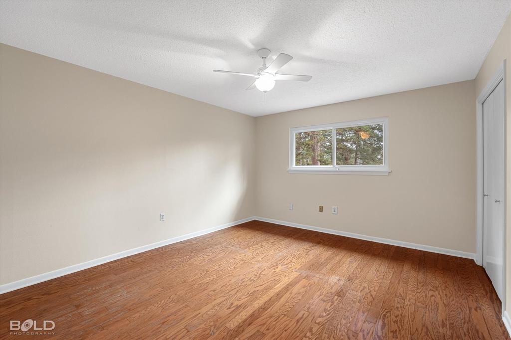 15 Lee Lane Haughton, LA 71037 - Photo 21 of 39 an empty room with wooden floor and windows
