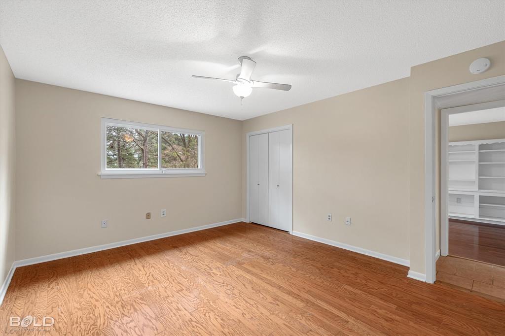15 Lee Lane Haughton, LA 71037 - Photo 22 of 39 wooden floor in an empty room with a window