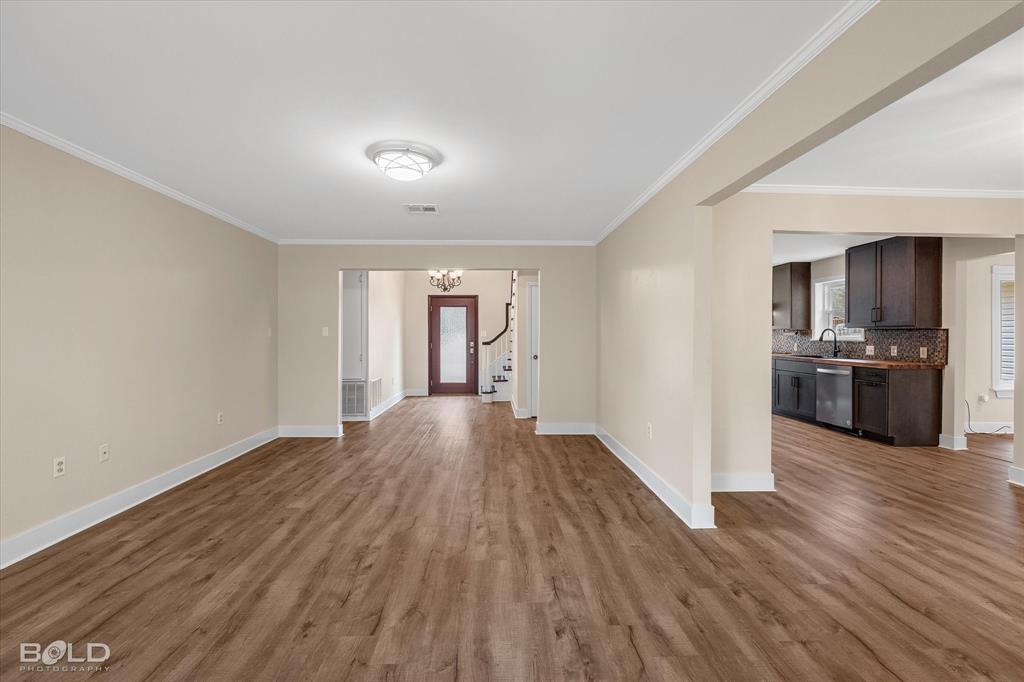 15 Lee Lane Haughton, LA 71037 - Photo 3 of 39 a view of a kitchen with wooden floor and stainless steel appliances