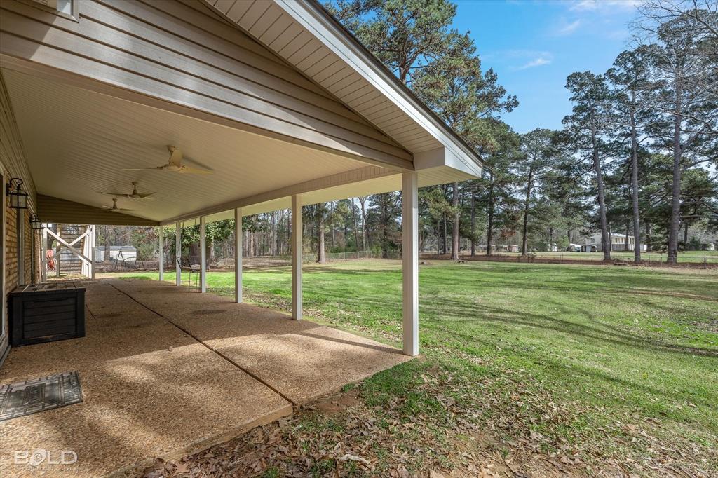 15 Lee Lane Haughton, LA 71037 - Photo 33 of 39 a view of a backyard with porch and entertaining space