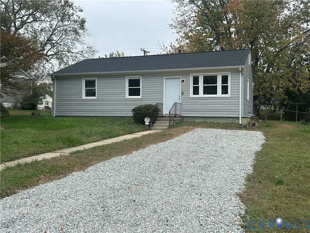 a house view with a backyard space