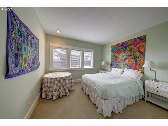 a bathroom with a sink vanity mirror and toilet