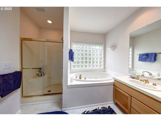 a living room with lots of furniture and a large window