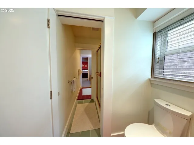 a bathroom with a tub and shower