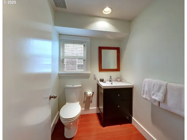 a bathroom with a toilet and a sink