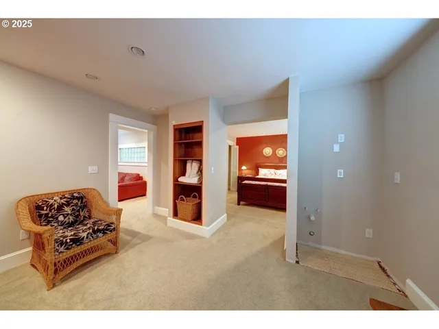 a bedroom with a bed and a chair