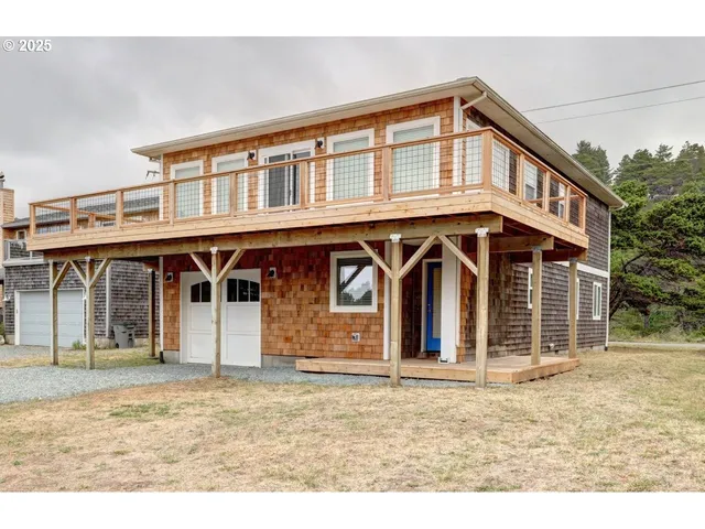 a view of balcony with wooden floor and barbeque oven