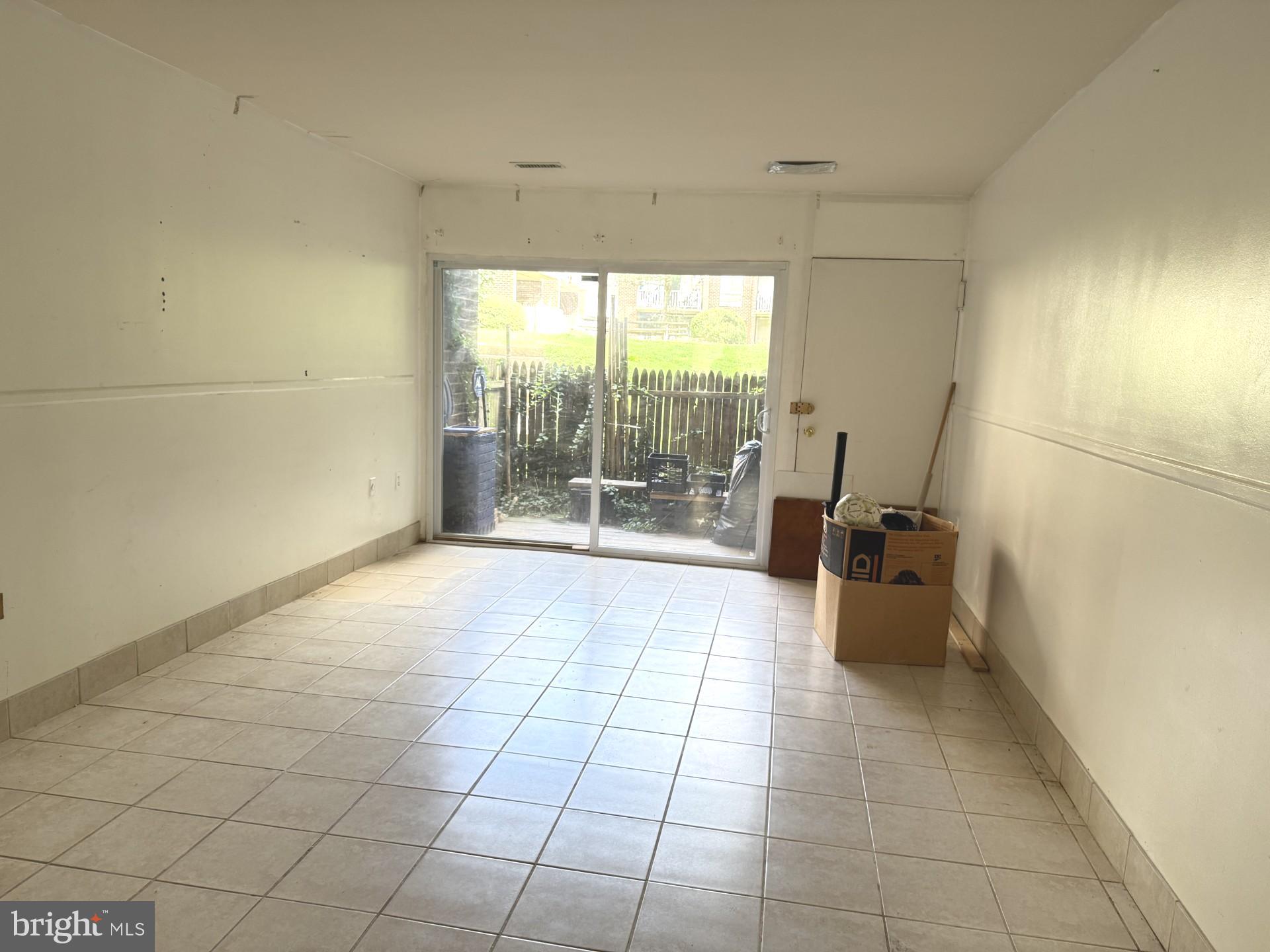 3976 Bel Pre Road, Unit 2 Silver Spring, MD 20906 - Photo 3 of 20 Living room with access to patio