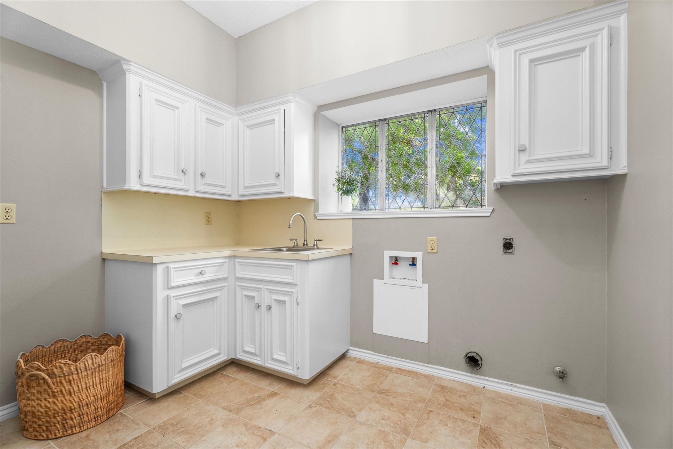 16267 Salmon Lane Spring, TX 77379 - Photo 14 of 48 Laundry room attached to the kitchen is a gem! A large walk in pantry, laundry sink, storage, and room for washer and dryer and an extra fridge or freezer provide abundant space for laundry tasks but can easily be closed off from the kitchen.