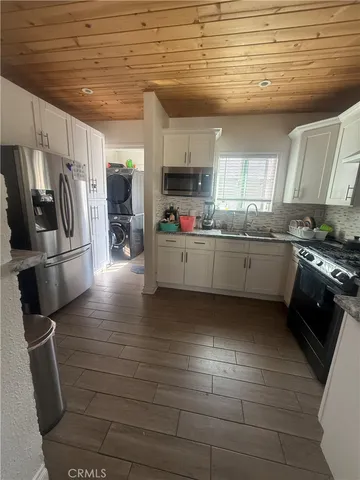 a bathroom with a double vanity sink toilet and shower