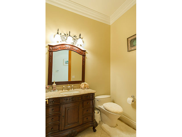 1832 Black Mountain Road Hillsborough, CA 94010 - Photo 12 of 22 a bathroom with a toilet a sink and mirror