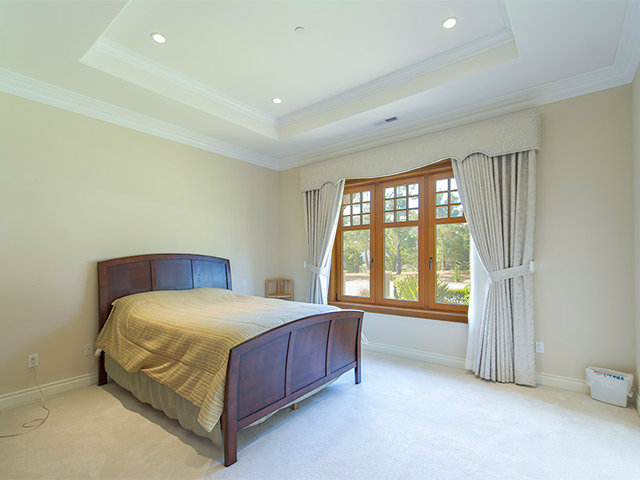 1832 Black Mountain Road Hillsborough, CA 94010 - Photo 14 of 22 a bedroom with a bed and a window