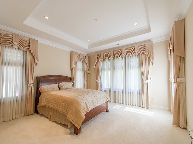 1832 Black Mountain Road Hillsborough, CA 94010 - Photo 17 of 22 a bedroom with a bed and a window