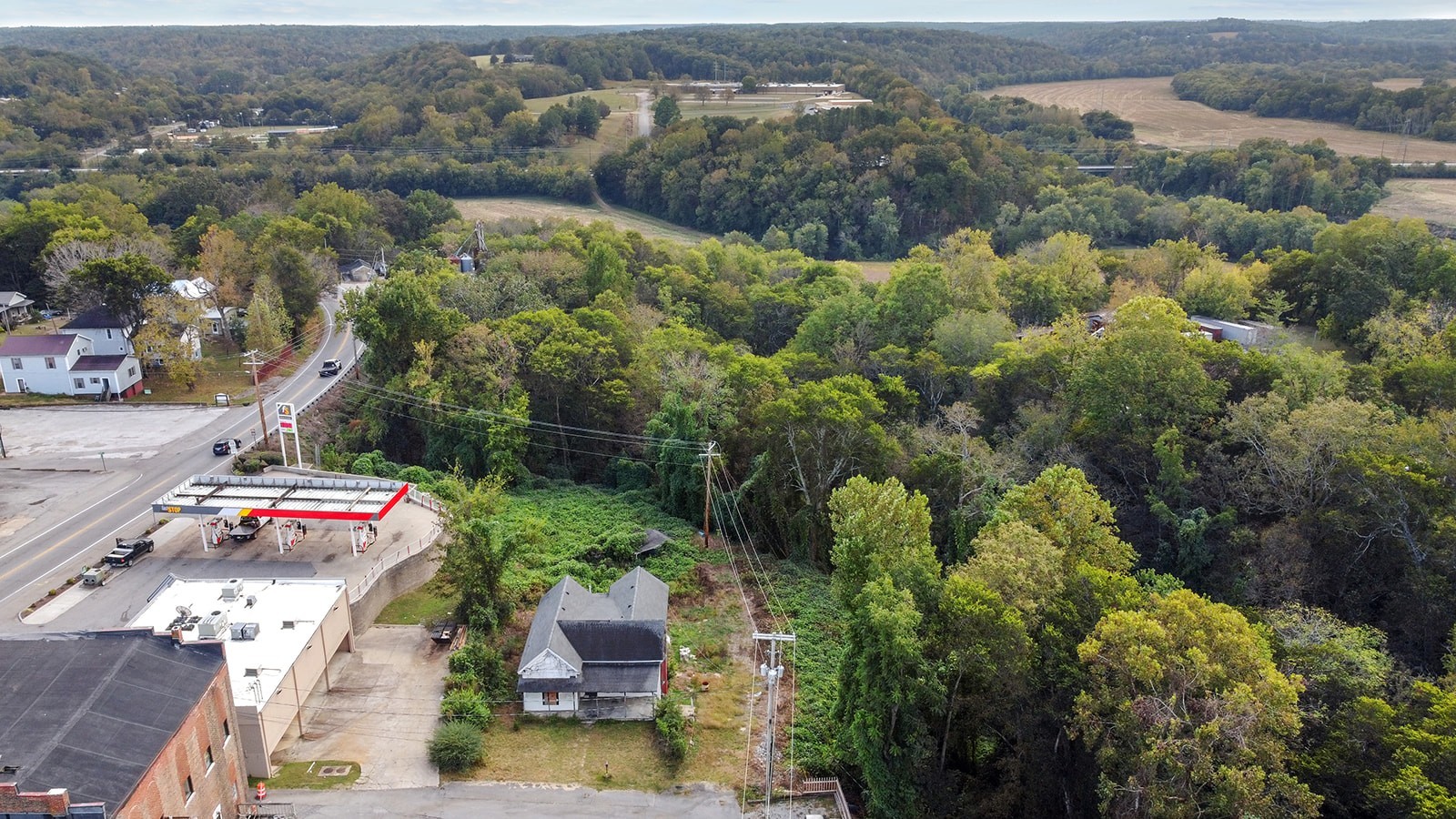 an aerial view of residential house with outdoor space and street view