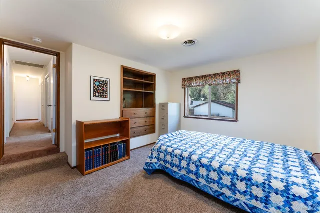 a bedroom with a bed and a cabinets