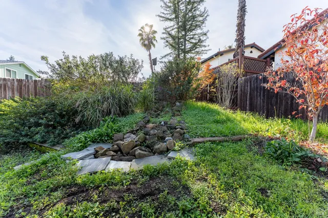 a backyard of a house with lots of green space