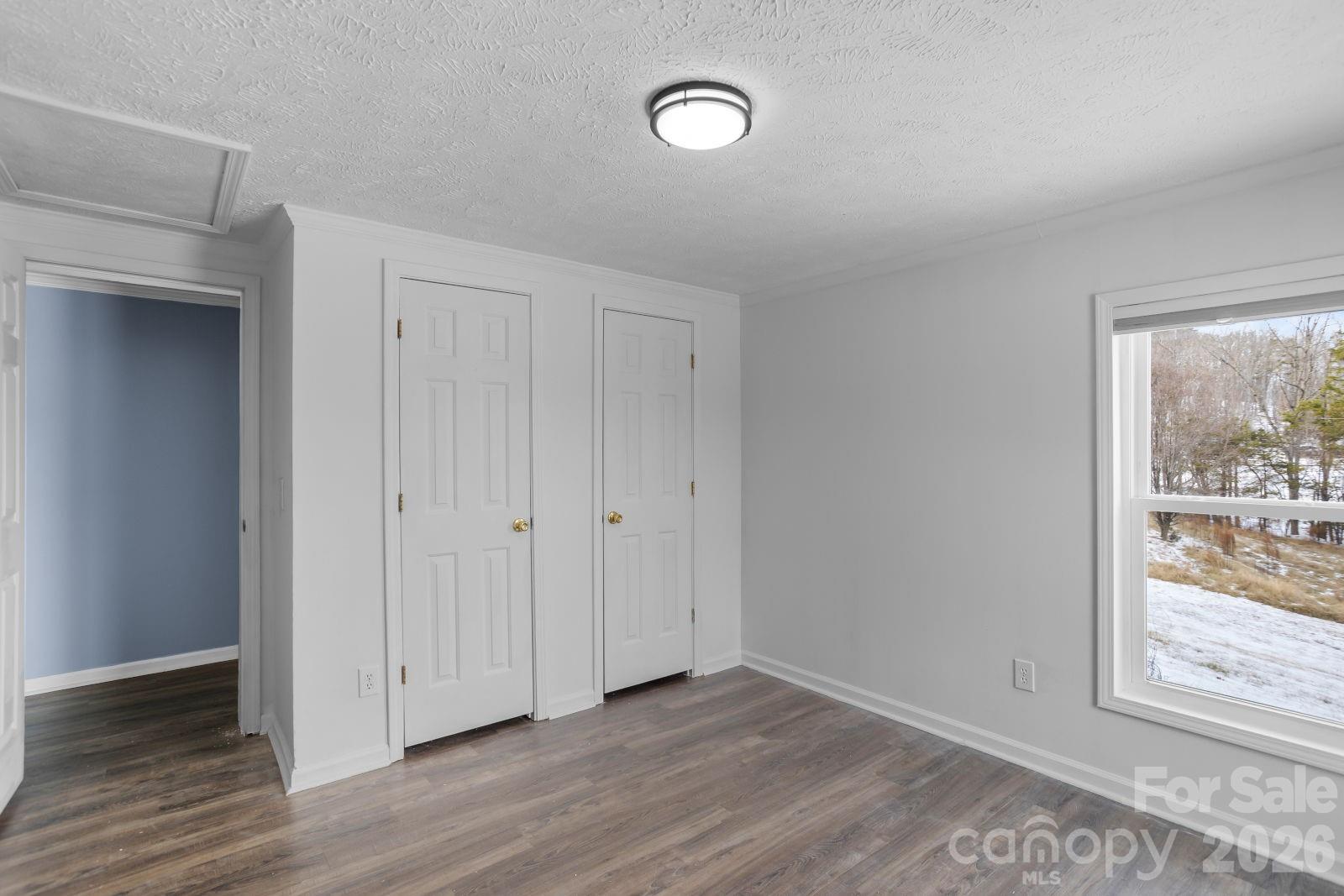 4855 Talley Road Walkertown, NC 27051 - Photo 36 of 45 a view of an empty room with wooden floor and a window