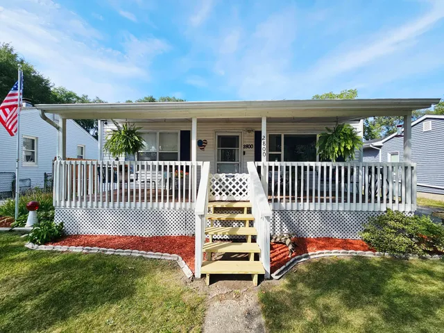 a front view of a house with a porch