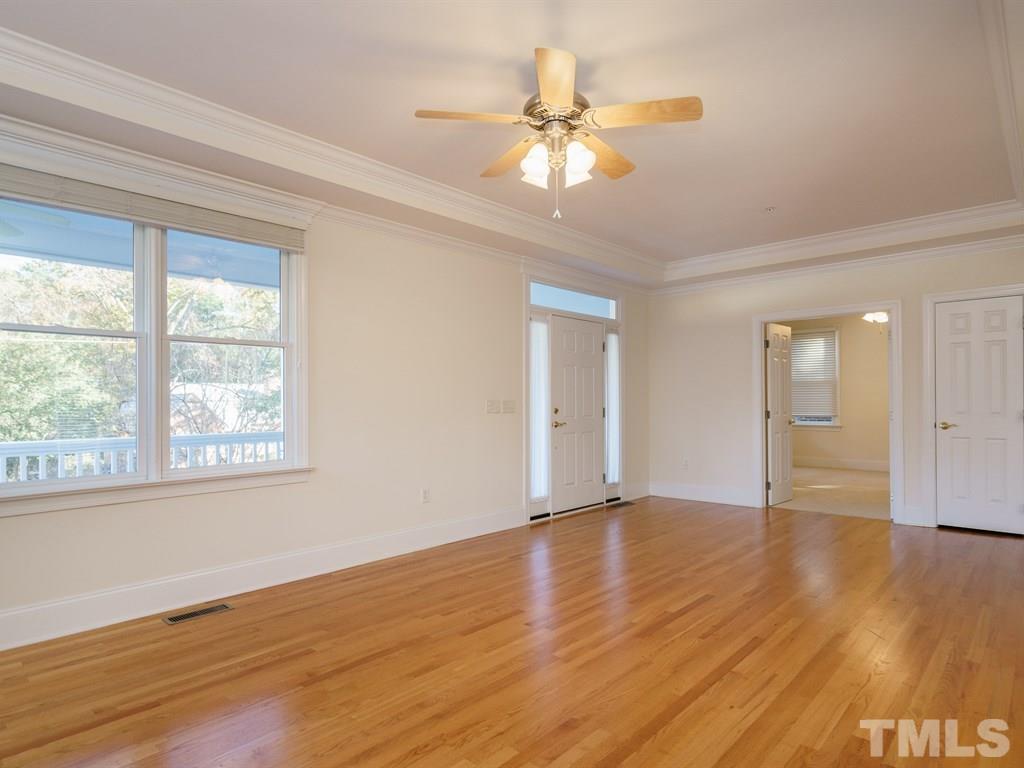 2707 Everett Avenue Raleigh, NC 27607 - Photo 8 of 23 a view of an empty room with wooden floor and a window