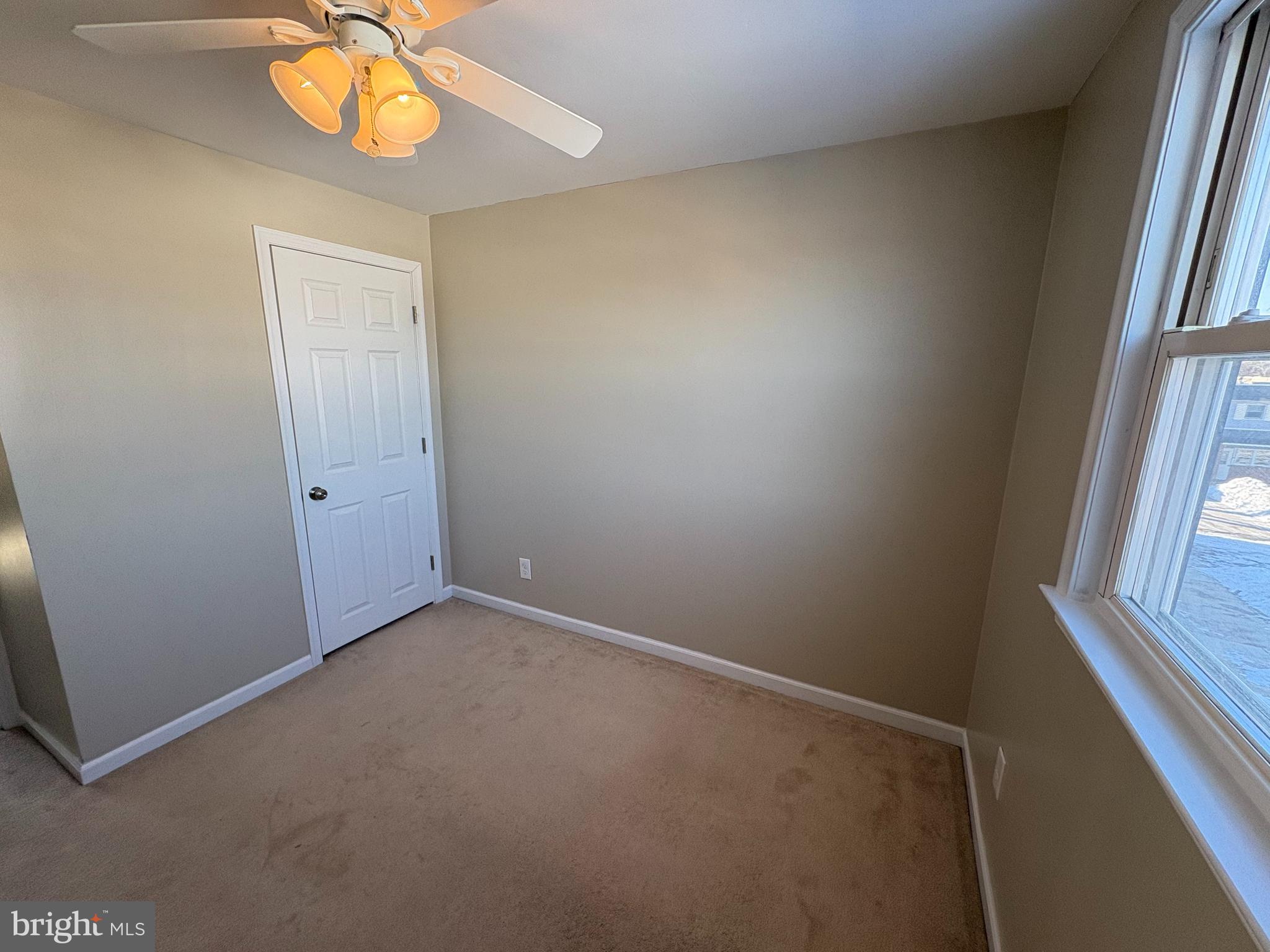 3251 Morning Glory Road Philadelphia, PA 19154 - Photo 11 of 19 an empty room with a chandelier fan and window