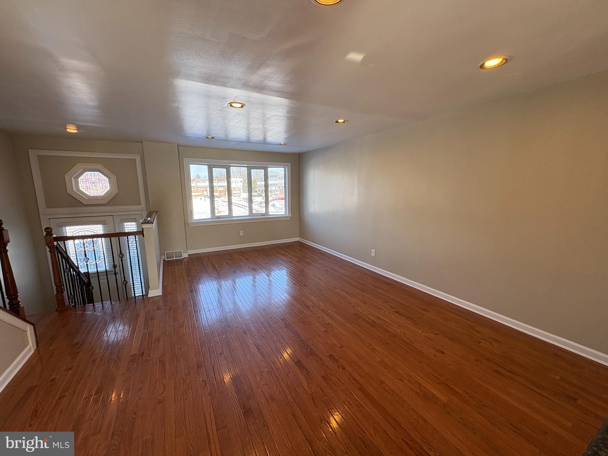 3251 Morning Glory Road Philadelphia, PA 19154 - Photo 3 of 19 wooden floor in an empty room with a window