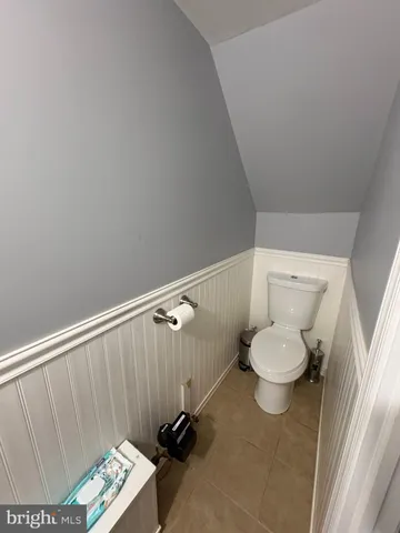 a bathroom with a toilet and a sink