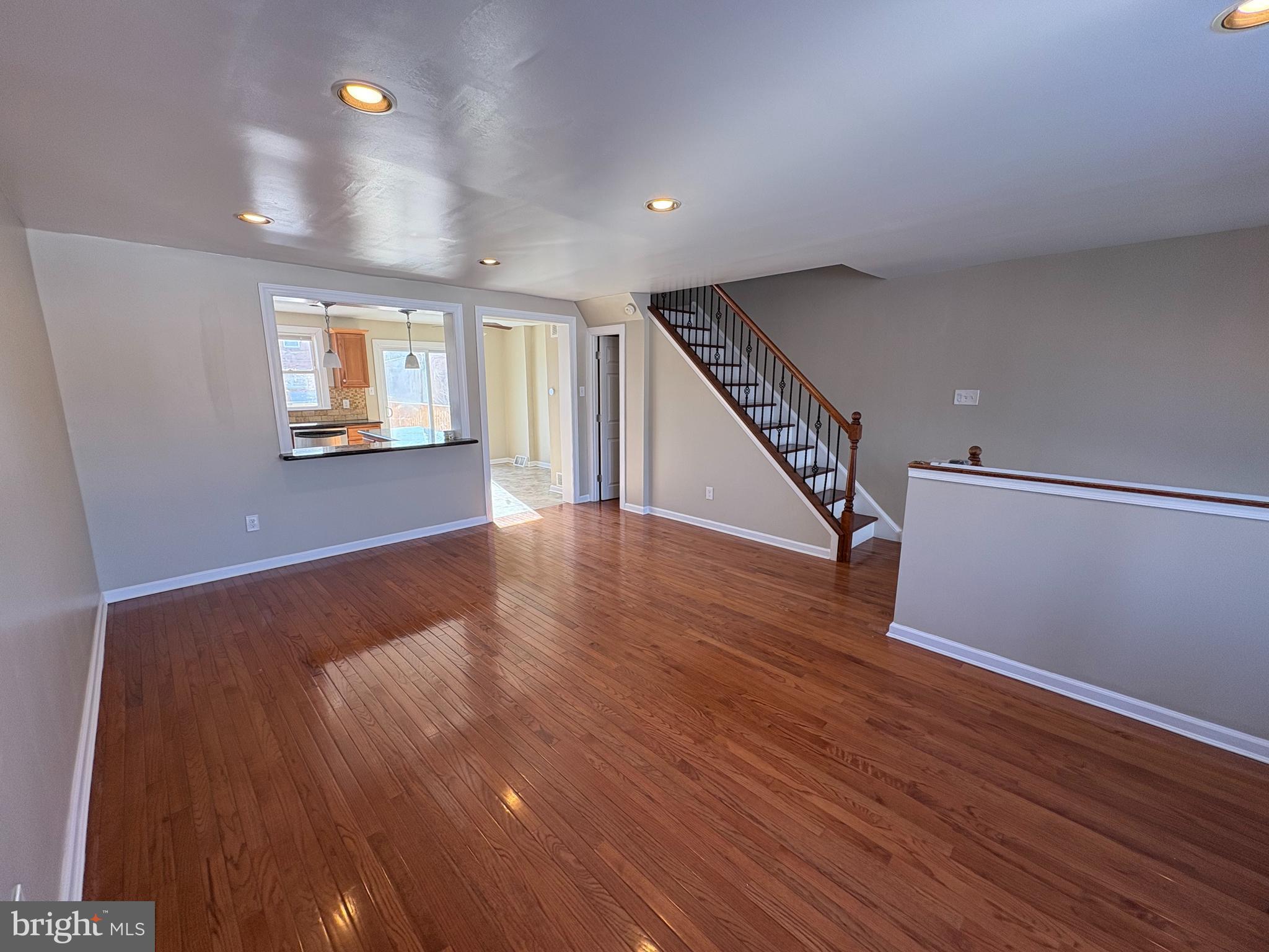 3251 Morning Glory Road Philadelphia, PA 19154 - Photo 5 of 19 a view of an empty room with wooden floor and stairs