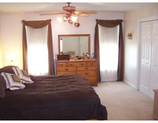 2001 Greenwich Road Hardwick, MA 01082 - Photo 11 of 27 a bedroom with a bed and a chandelier