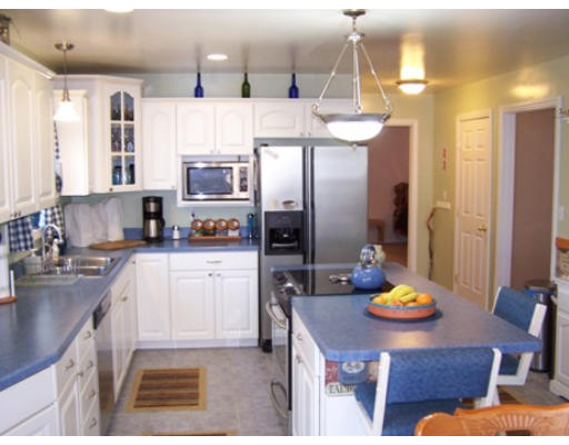 2001 Greenwich Road Hardwick, MA 01082 - Photo 7 of 27 a kitchen with a refrigerator a stove a sink and a dining table