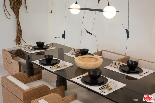 a view of hallway with a large mirror and a shower