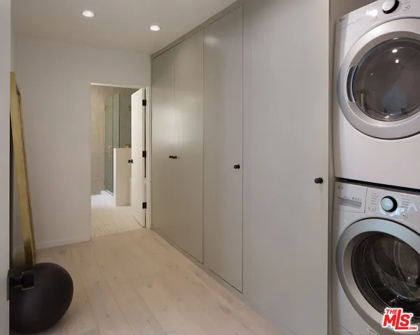 a bathroom with a shower and a sink