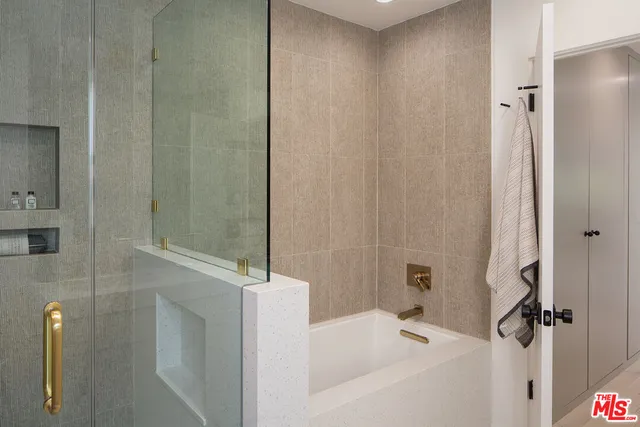 a bathroom with a mirror and a sink