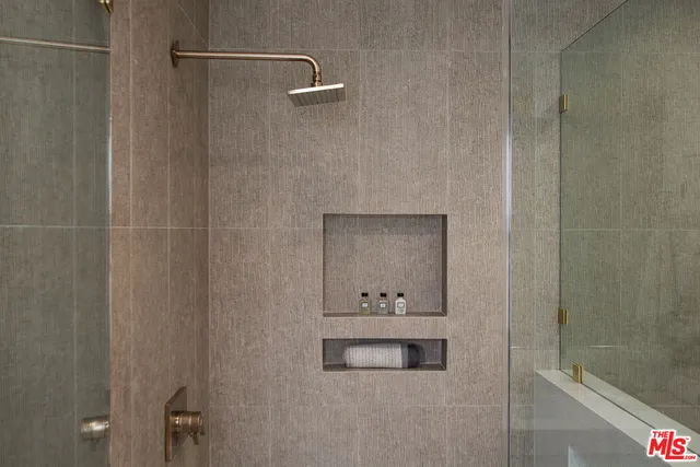 a bathroom with a double vanity sink and mirror