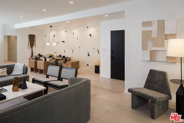 a kitchen with stainless steel appliances granite countertop a sink a refrigerator and a stove