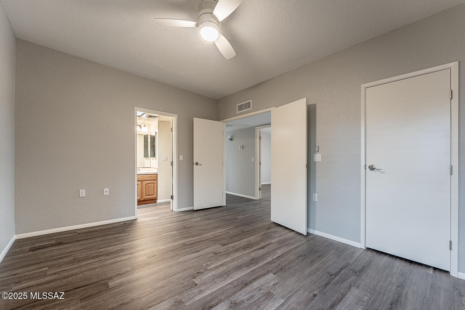 931 West Rio Guaymas Green Valley, AZ 85614 - Photo 22 of 39 a view of wooden floor and windows in an empty room