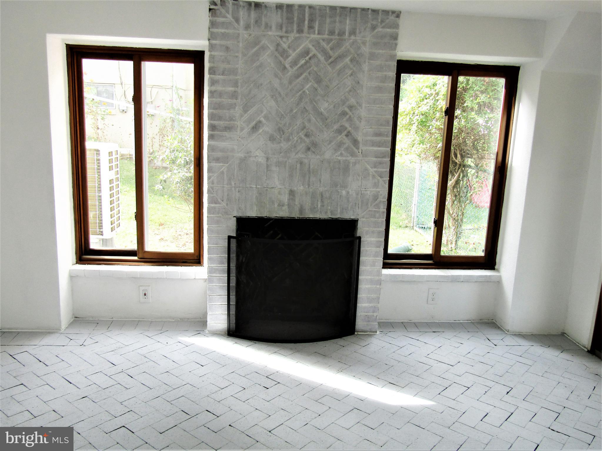566 Forest View Road Linthicum Heights, MD 21090 - Photo 30 of 51 Wood fireplace in 4 seasons room