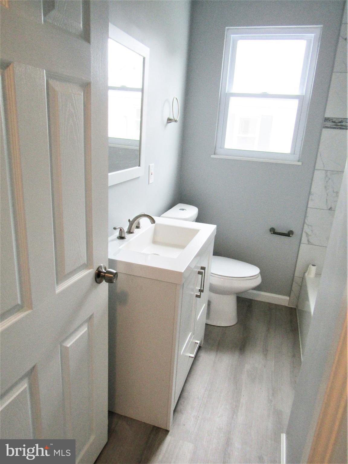 566 Forest View Road Linthicum Heights, MD 21090 - Photo 43 of 51 Main bath- new flooring,v anity and toilet