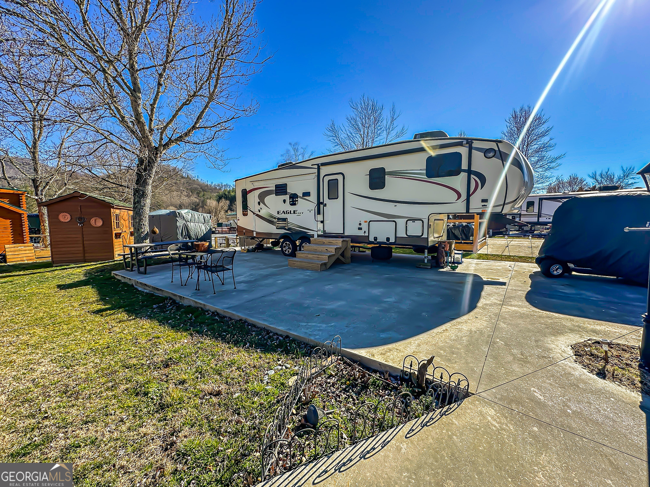 Lot 60 Holiday Rambler Dillard, GA 30537 - Photo 2 of 6 a front view of a house with garden
