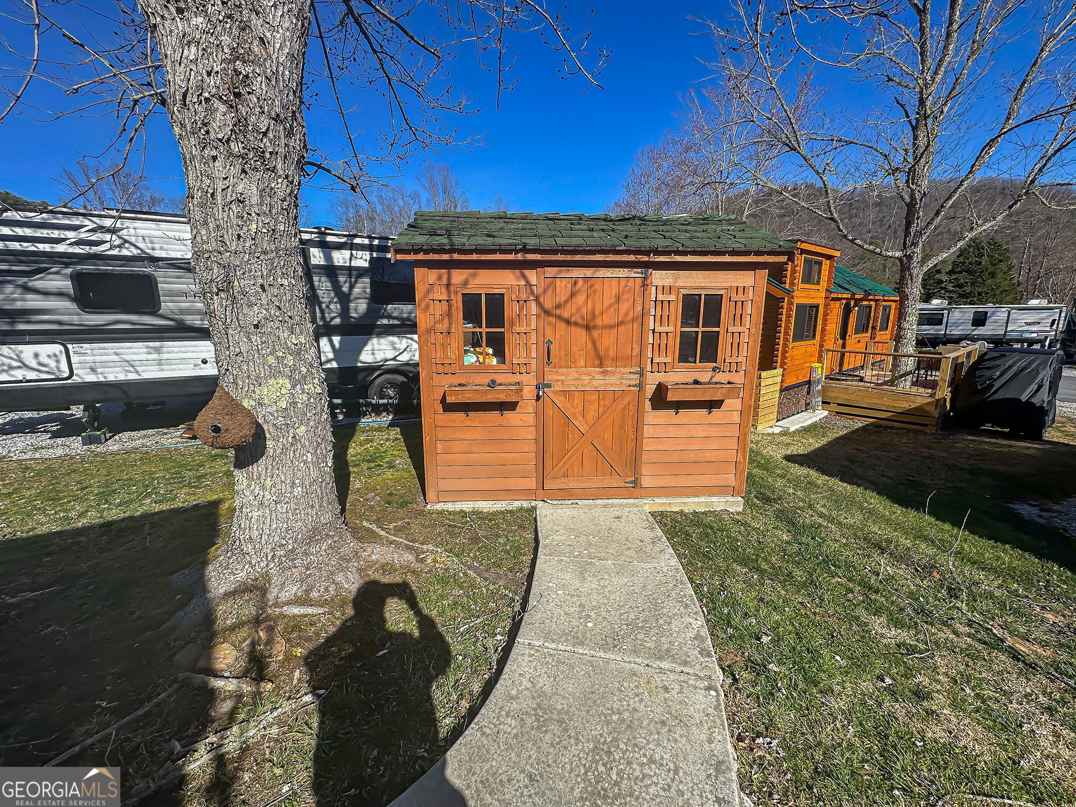 Lot 60 Holiday Rambler Dillard, GA 30537 - Photo 4 of 6 a front view of a house with a yard