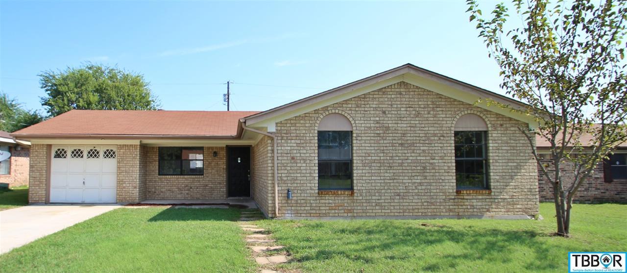 807 Colonial Lane Killeen, TX 76543 - Photo 1 of 1 a front view of a house with a yard and garage