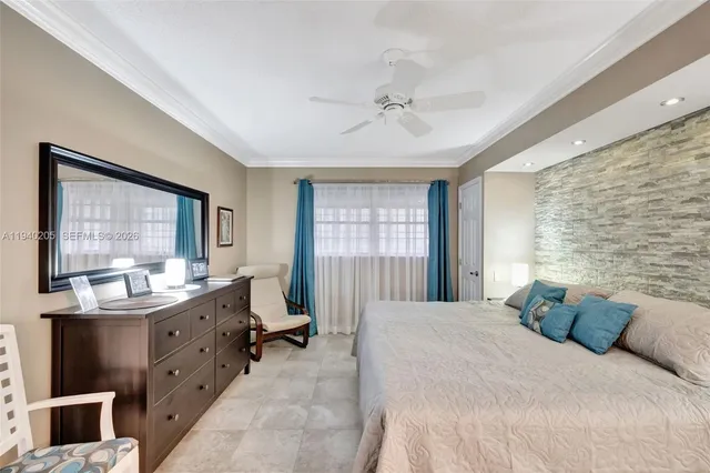 a spacious bedroom with a large bed and a window