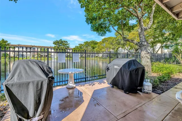 a view of a chairs and table in the balcony