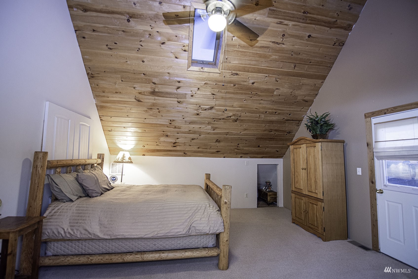 14352 Highway 12 Touchet, WA 99360 - Photo 23 of 40 a bedroom with a bed and wooden floor