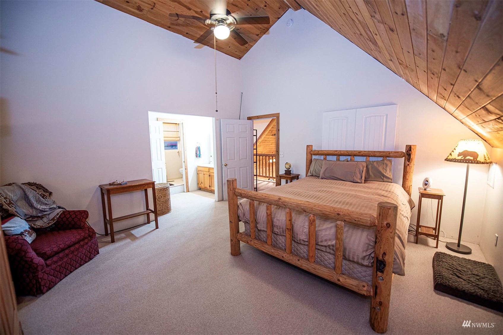 14352 Highway 12 Touchet, WA 99360 - Photo 24 of 40 a bedroom with a bed a chandelier and dresser