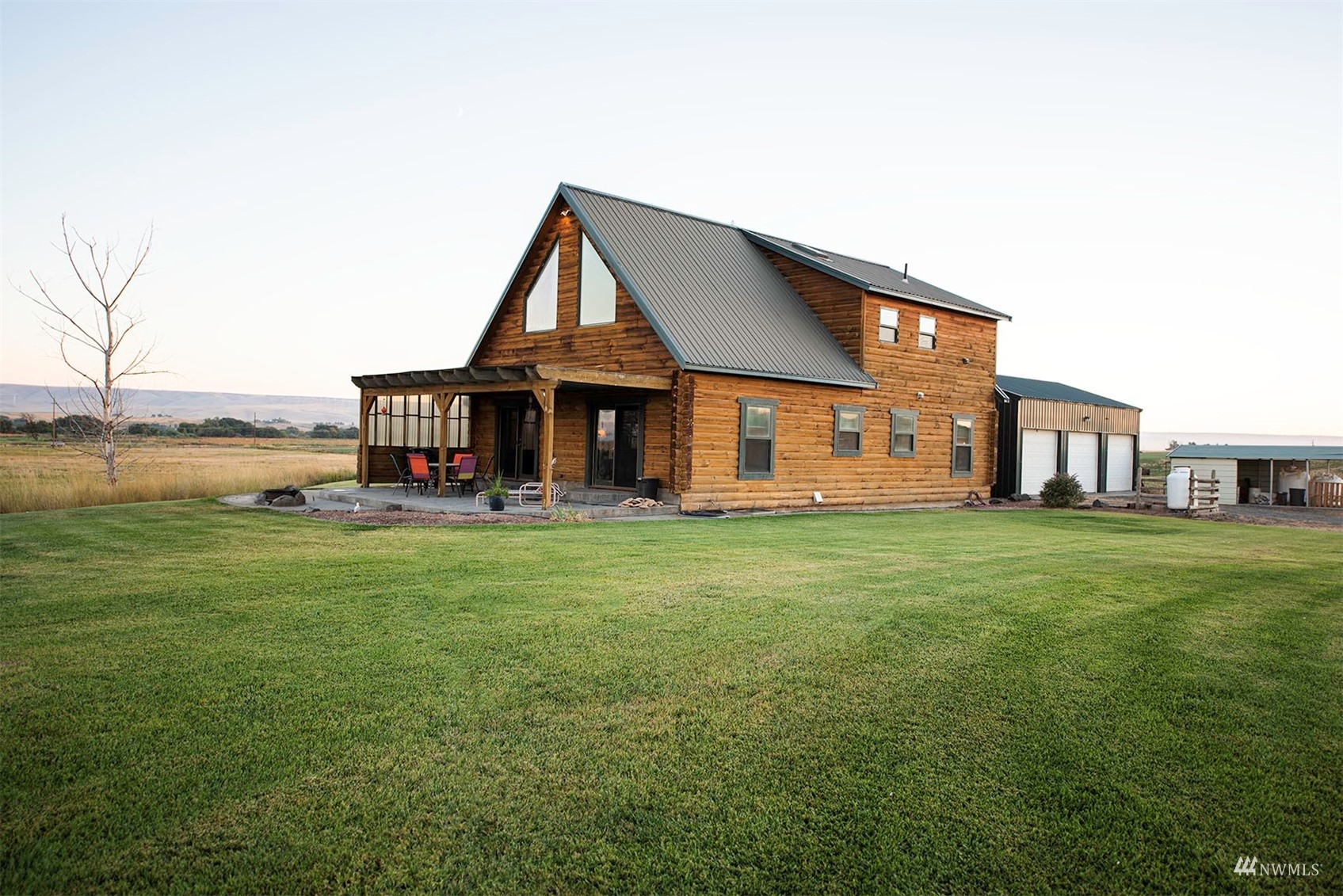 14352 Highway 12 Touchet, WA 99360 - Photo 3 of 40 a front view of a house with a garden and porch