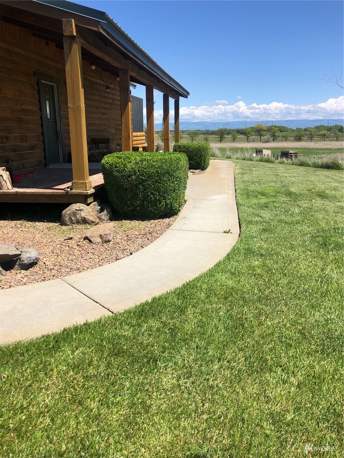 14352 Highway 12 Touchet, WA 99360 - Photo 5 of 40 a view of a patio with a table and chairs