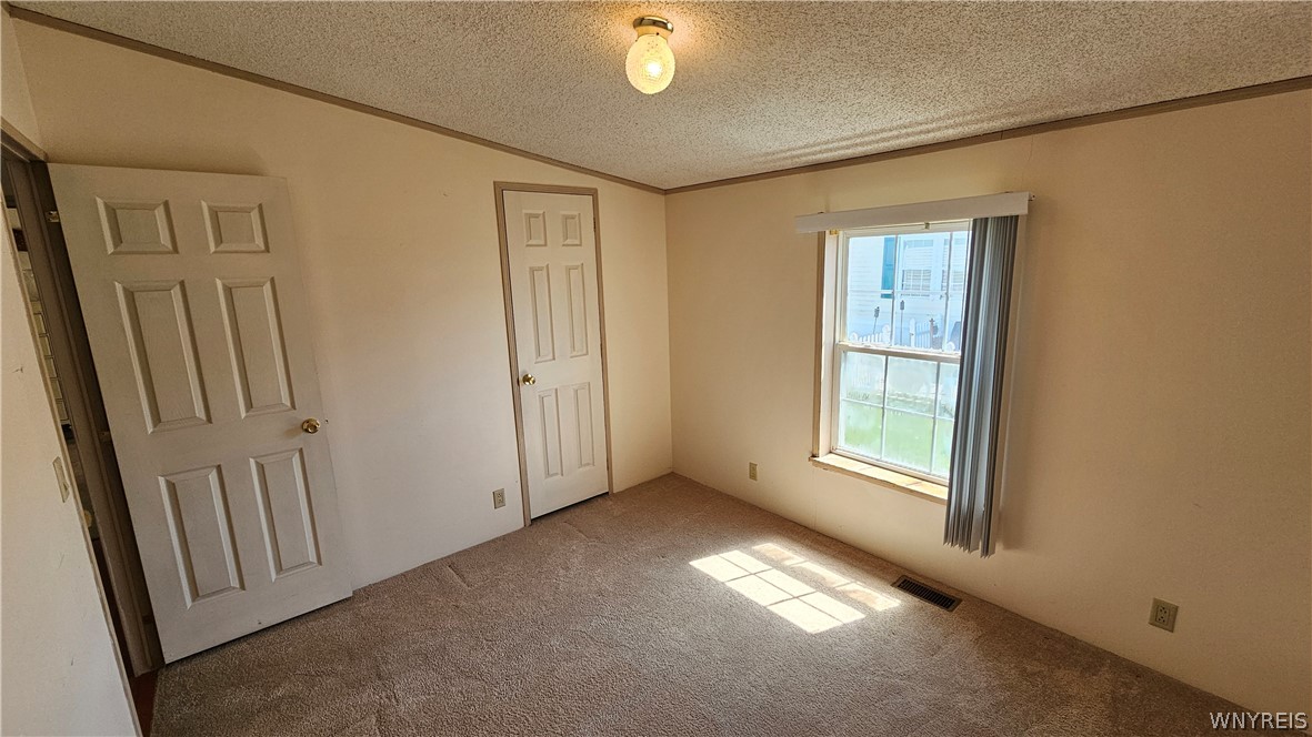 20 Calla Way Cheektowaga, NY 14043 - Photo 22 of 31 Bedroom 2 with vaulted ceiling
