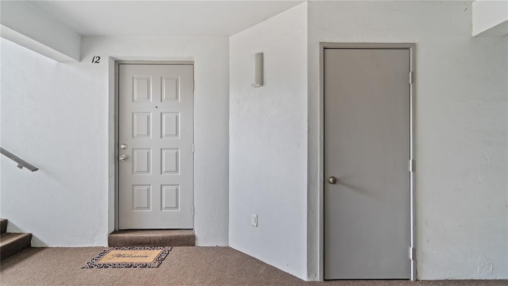 8203 Sun Spring Circle, Unit 12 Orlando, FL 32825 - Photo 31 of 38 a view of an entryway with front door
